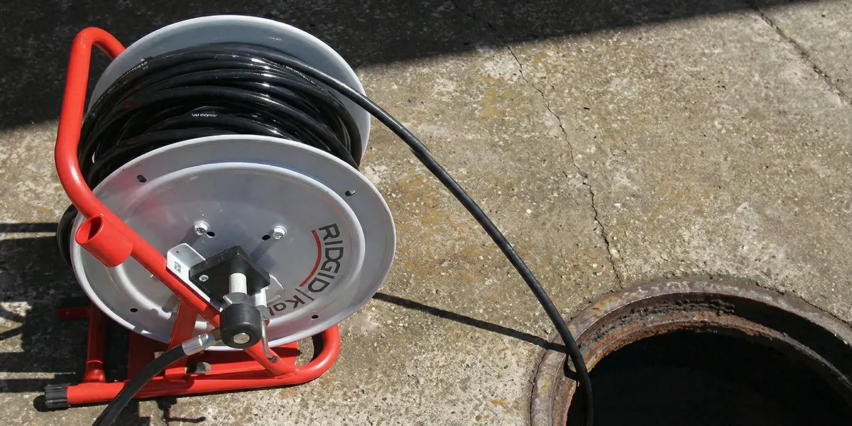 sewer rodding equipment prepared to clear clogged sewer lines in Cleveland, OH